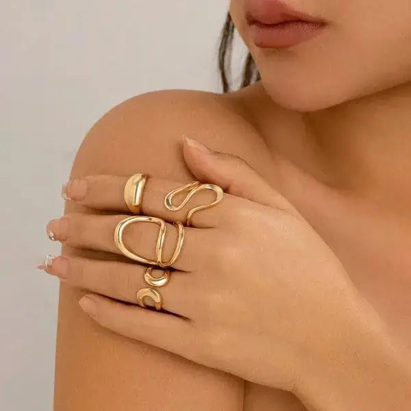 Aurelva Gold Plated Abstract Shape Finger Rings Set for Women and Girls | Adjustable Stackable Fashion Jewellery (Set of 4) Aurelva