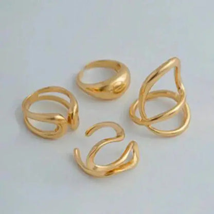Aurelva Gold Plated Abstract Shape Finger Rings Set for Women and Girls | Adjustable Stackable Fashion Jewellery (Set of 4) Aurelva