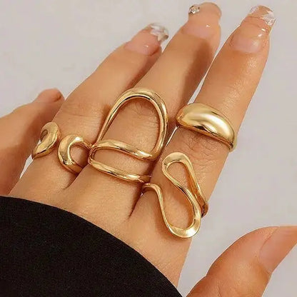 Aurelva Gold Plated Abstract Shape Finger Rings Set for Women and Girls | Adjustable Stackable Fashion Jewellery (Set of 4) Aurelva