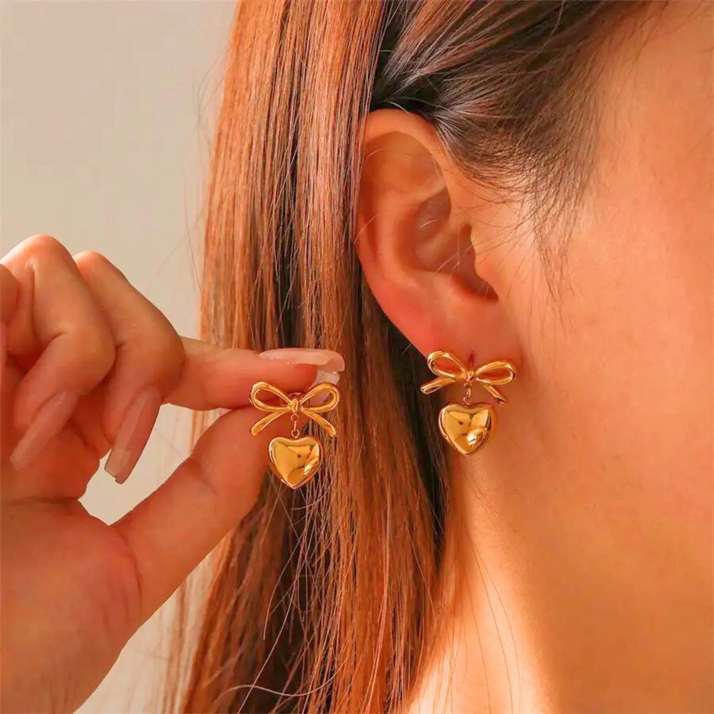 Aurelva Gold-Plated Bow and Heart Drop Earrings Aurelva
